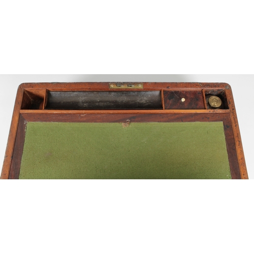 1463 - A Victorian mahogany writing box with twin brass handles and brass straps, opening to reveal a baize... 