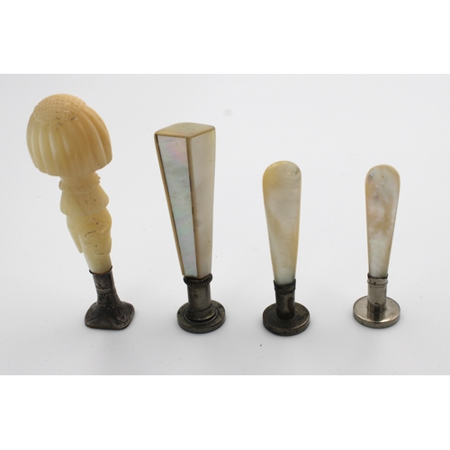 1487 - A 19th century mother of pearl desk seal in the form of a hand with a reeded domed top and ruffled s... 