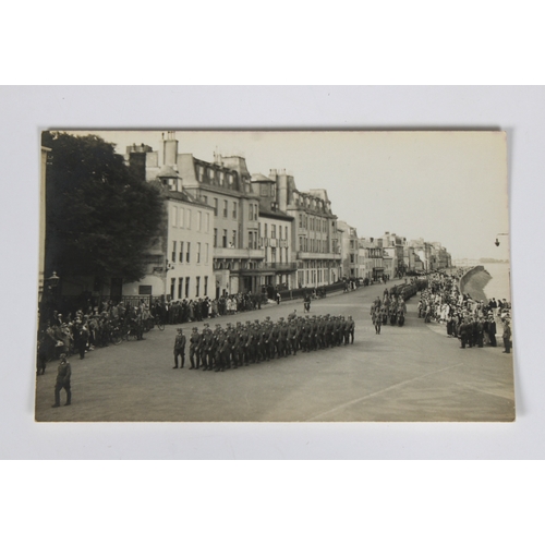 1509 - A collection of German Occupation of Guernsey postcards etc to include soldiers marching, harbour bo... 