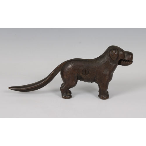 1511 - An early 20th century novelty cast iron nutcracker in the form of a dog 23cm. long.