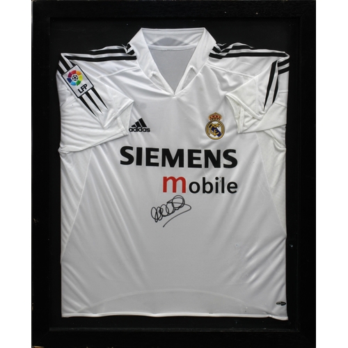 1521 - A 2004-2005 Real Madrid home football shirt sign by Micheal Owen in black marker to centre just belo... 