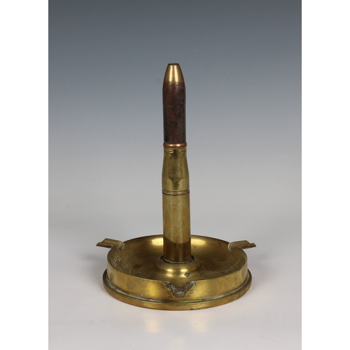 1535 - Trench Art - Ashtray with integral bullet lighter the ashtray fashioned from a shell casing, having ... 