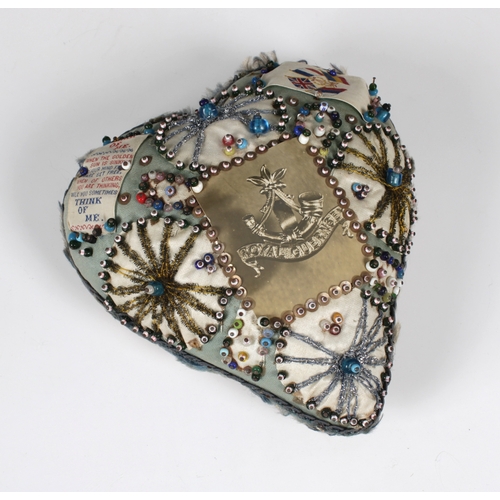 1539 - A Royal Guernsey Light Infantry sweetheart's pin cushion in the form of a heart, worked in pale blue... 