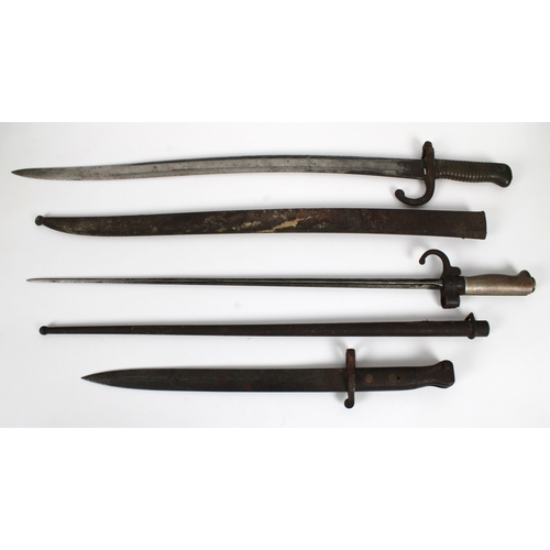 1550 - Three bayonets - A 19th century French M1866 Chassepot rifle sword bayonet 57.6cm. single edged blad... 