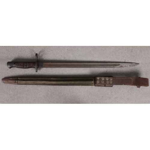 1554 - An American 1917 Pattern Remington bayonet with scabbard 42.8cm. sharpened pointed blade with single... 