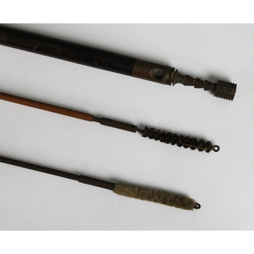 1556 - Three rifle barrel cleaners of varying types wooden and brass, steel and brass, cane with a turned w... 