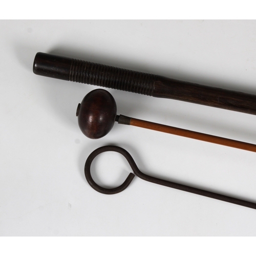 1556 - Three rifle barrel cleaners of varying types wooden and brass, steel and brass, cane with a turned w... 