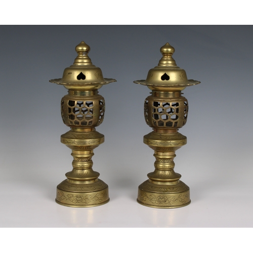 699 - A pair of Japanese style temple lamps / candle lamps having opening pierced galleries for tea lights... 