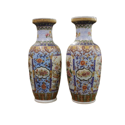 713 - A pair of 20th century floor standing Chinese vases of baluster form, extensively enamelled with flo... 