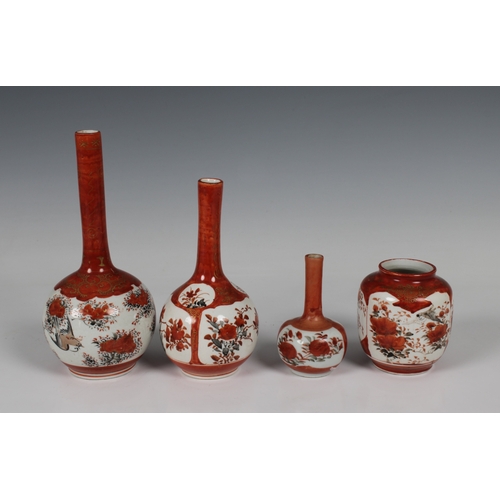 715 - A small collection of Japanese Kutani porcelain to include three bottle vases, having elongated long... 