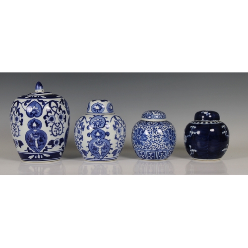 718 - Four Chinese blue & white ginger jars with covers the smaller dark blue version decorated with prunu... 