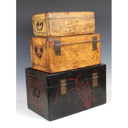 729 - Three Chinese storage boxes 20th century, each of rectangular form with with ornate locking clasp an... 