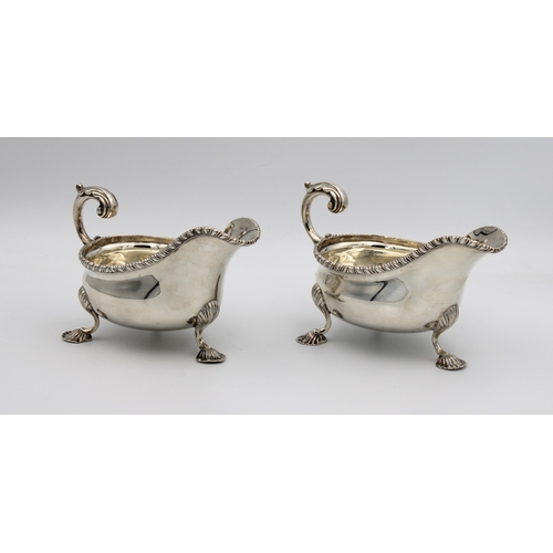 1016 - **WITHDRAWN**
A pair of Edwardian silver sauce boats Charles Stuart Harris, London, 1902, of typical... 