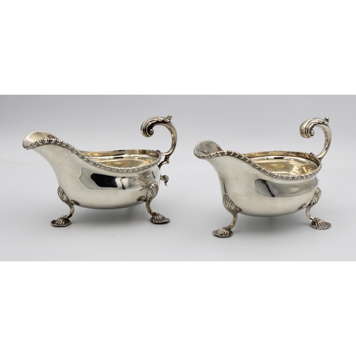 1016 - **WITHDRAWN**
A pair of Edwardian silver sauce boats Charles Stuart Harris, London, 1902, of typical... 