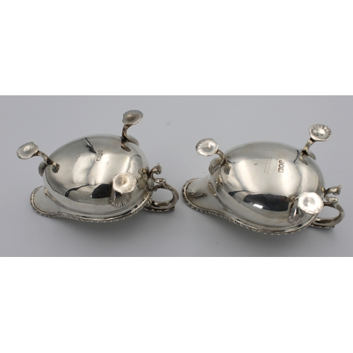 1016 - **WITHDRAWN**
A pair of Edwardian silver sauce boats Charles Stuart Harris, London, 1902, of typical... 