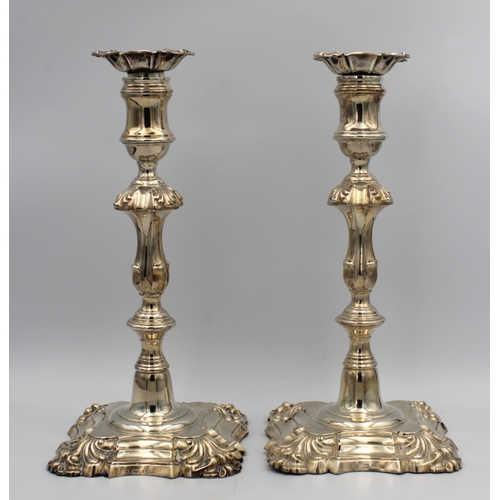 1018 - A pair of George IV silver table candlesticks Creswick & Co, Sheffield, 1829, having shaped & steppe... 