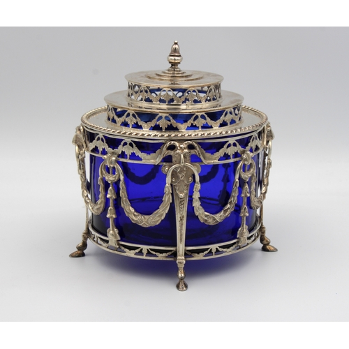 1020 - **WITHDRAWN**
An ornate Dutch silver preserve pot / sugar basin with heavy blue glass liner the pier... 