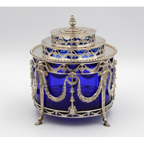 1020 - **WITHDRAWN**
An ornate Dutch silver preserve pot / sugar basin with heavy blue glass liner the pier... 