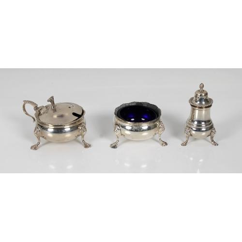 1028 - A silver cruet set Garrard & Co Ltd, Birmingham, 1977, of cauldron form, comprising of mustard, open... 