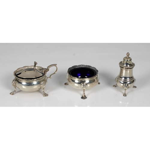 1028 - A silver cruet set Garrard & Co Ltd, Birmingham, 1977, of cauldron form, comprising of mustard, open... 