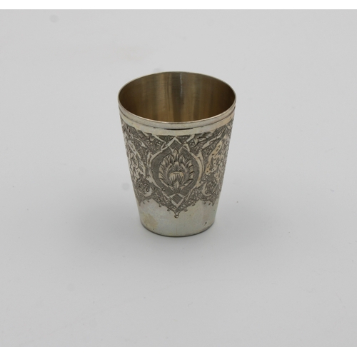 1031 - A Persian / Iranian silver tot cup marked 'VARTAN', of typical form with intricate decoration, 4.6cm... 