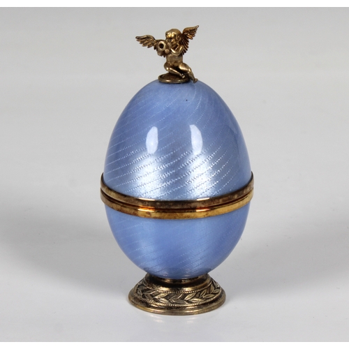 1038 - **WITHDRAWN**
A cased Sarah Faberge silver gilt and blue enamelled surprise egg the detachable top s... 