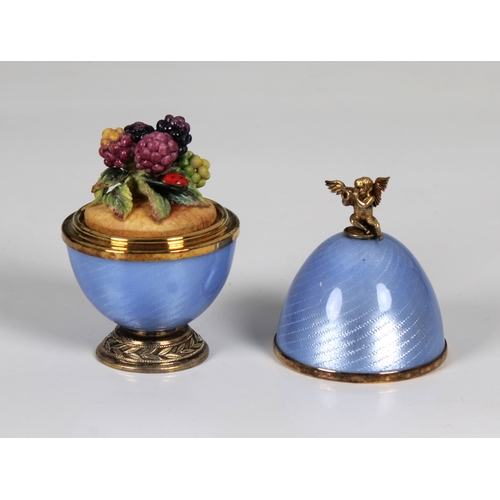 1038 - **WITHDRAWN**
A cased Sarah Faberge silver gilt and blue enamelled surprise egg the detachable top s... 