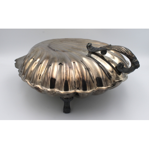 1043 - A large silver plate scallop shell warming dish probably by the Sheffield silver Company, United Sta... 