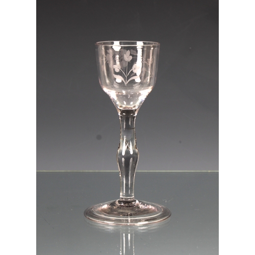 113 - A mid-18th century engraved wine glass c.1750, the ogee bowl wheel engraved with a rose and floral s... 