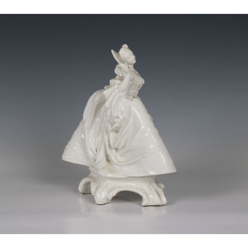 15 - A Nymphenburg white porcelain figure of a lady with a fan circa 1920, perhaps from a model by J.P.R.... 