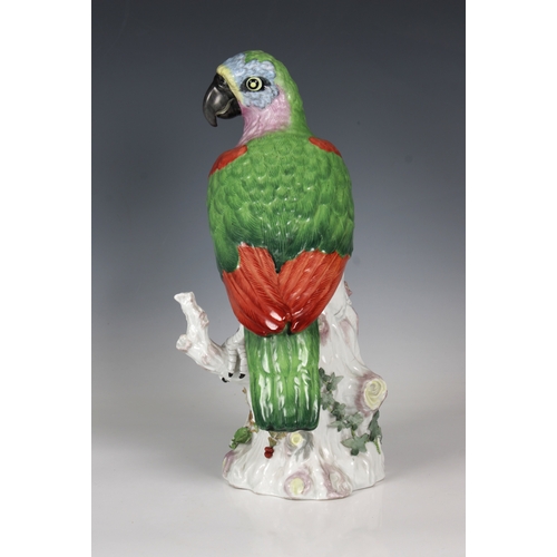 21 - An early 20th century Carle Thieme, Germany, porcelain parrot with polychrome decoration and applied... 