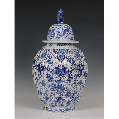 45 - An early 20th century Royal Delft style blue and white octagonal ribbed jar & cover of baluster form... 