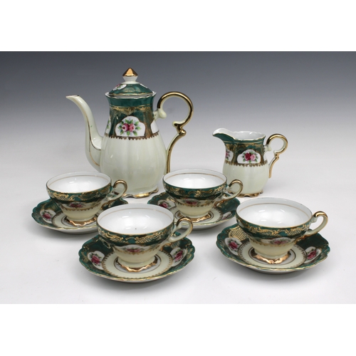 46 - A Crown China coffee service comprising coffee pot, milk jug and four cups & saucers, floral pattern... 