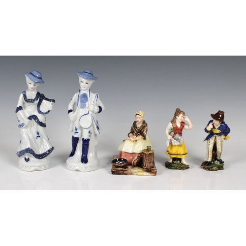 49 - A pair of 20th century porcelain figures of a young couple gesturing to each other factory marked be... 