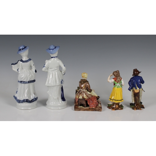 49 - A pair of 20th century porcelain figures of a young couple gesturing to each other factory marked be... 