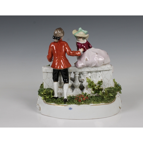 50 - A Sitzendorf, Germany, porcelain group of a courting couple on a bridge with two swans underglaze bl... 