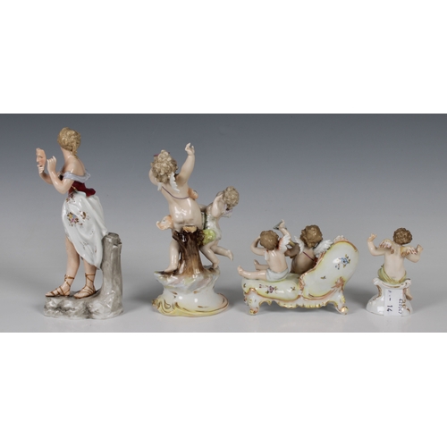 54 - A Volkstedt-Rudolstadt, Germany, porcelain figure group of putti playing a lyre and triangle sitting... 