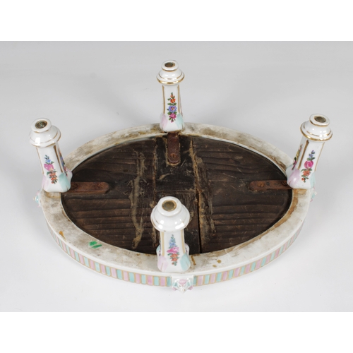 57 - A 19th century Continental oval hand painted porcelain table on four fluted legs, floral decoration ... 