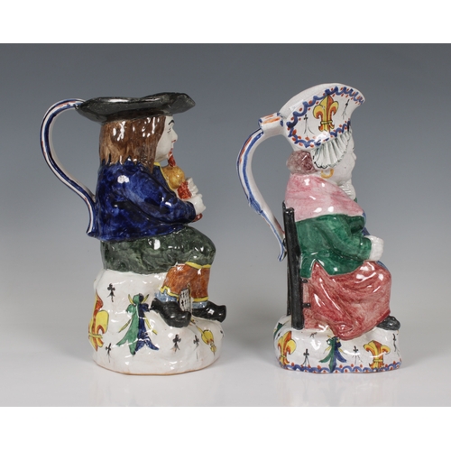 63 - A pair of Falaise ceramic figural jugs of a man playing the bag pipes and a woman, the woman marked ... 