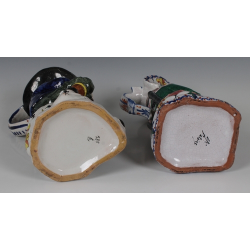 63 - A pair of Falaise ceramic figural jugs of a man playing the bag pipes and a woman, the woman marked ... 