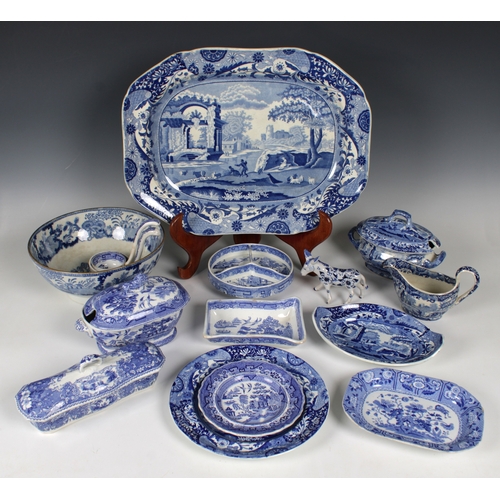 66 - A collection of 19th century blue and white ceramics comprising a footed bowl, a meat platter, two s... 