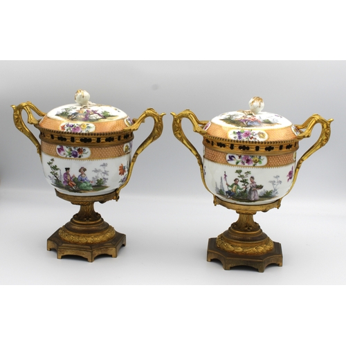 8 - A pair of Meissen ormolu mounted potpourri urns and covers 19th Century, painted with scenes of cour... 