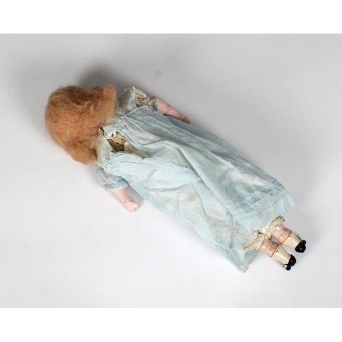 144 - A poured wax shoulder head doll probably English, 19th century, the face with fixed blue glass eyes,... 