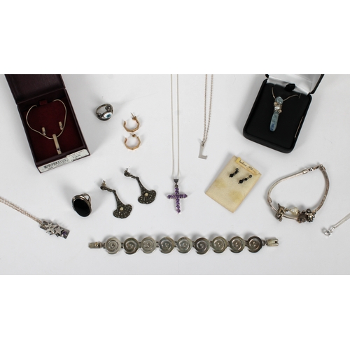 1139A - A collection of silver and costume jewellery

featuring various silver pendants and stylised pendant... 