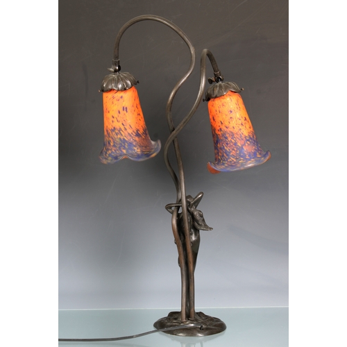 132 - A French Art Nouveau bronze and glass twin headed lamp by Les Lumieres de Nancythe orange and blue s... 