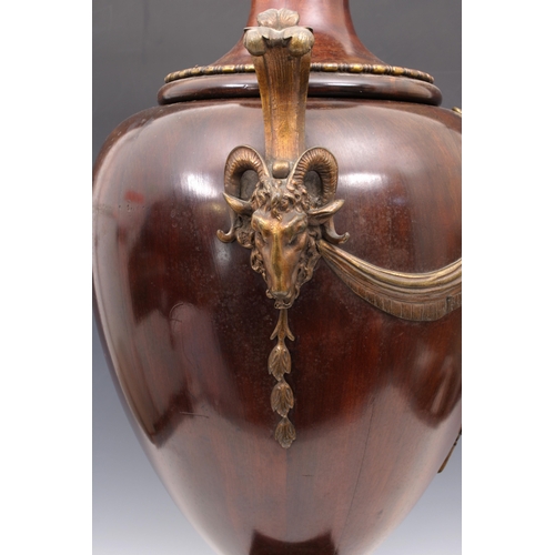 138 - A mahogany and ormolu mounted urn form wine cooler19th century, with waisted turned cover, ram's hea... 