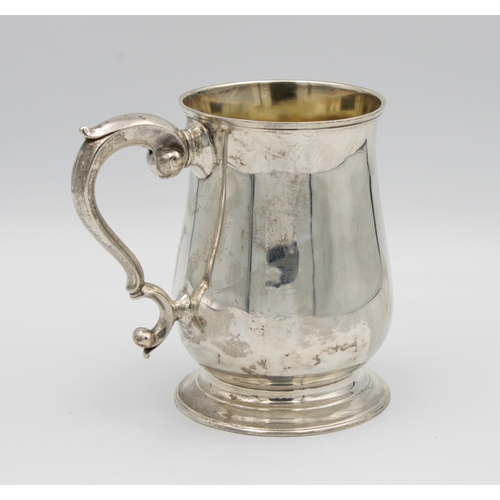 15 - A George II silver baluster tankardFuller White, London, 1756, of typical plain form with scroll han... 