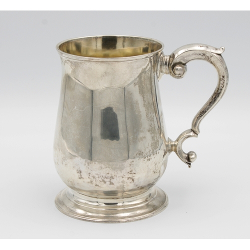 15 - A George II silver baluster tankardFuller White, London, 1756, of typical plain form with scroll han... 