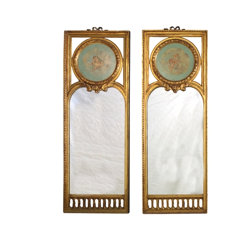 152 - A pair of 19th century Continental gilt wood mirrorseach with a painted oil tondo on panel of cherub... 