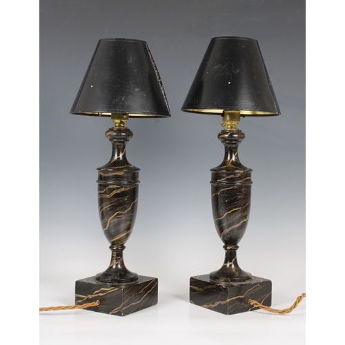 185 - A pair of black wooden painted urn bedside lampswith black shades, 45cm. high with shades. (2)